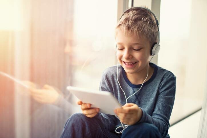 happy-little-boy-using-tablet-with-headphones-3