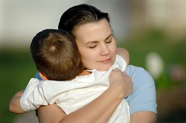 mother-hugging-her-son-tightly